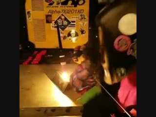 dad teaches daughter how to weld